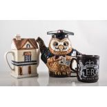 Sailor tea canister, novelty teapots, and commemorative mugs.