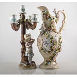 Continental porcelain five-light candelabra, rose encrusted, modelled with a girl, (restored),