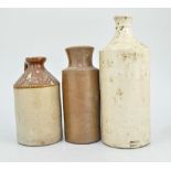 Quantity of stoneware ink bottles, jars and two embossed barrel filters.