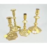 Eight various 18th century brass candlesticks