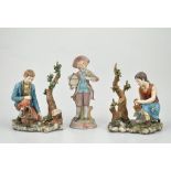 Pair of Capodimonte porcelain figures, Boy and Girl collection fruit, signed Volta, height 19cm,