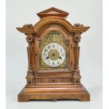 German stained walnut mantel clock, architectural case, with pilaster strips, arched brass dial,