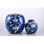 Two small blue and white ginger jars with covers, and another Prunus design missing cover,