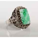 Dress ring set with Jade in silver, a carved and pierced slice of jade 17mm x 12mm,