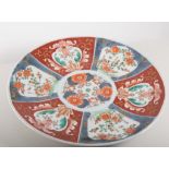 Japanese Imari pattern charger, floral decoration, diameter 30cms and two other chargers, (3).