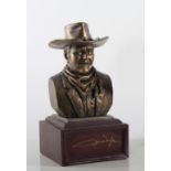John Wayne bookends, and a small bust.