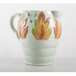 Clarice Cliff, "Autumn Leaves" jug and bowl, 19cms and 20cms, on pale green ground.