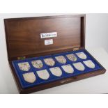 Cased set of silver Royal Arms medallions.