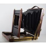 Ross mahogany cased plate camera with plates, three lenses and a tripod.