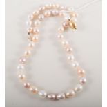 A baroque pearl necklace and matching earrings, pearls (40), approximately 8mm,