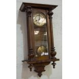 Vienna type stained beechwood wall clock, circular dial with Roman numerals, height 73cms.