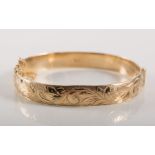 9 carat yellow gold solid half hinged bangle, 9.