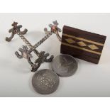 Box of costume jewellery and commemorative crowns, pair of silver-plated knife rests,