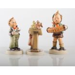 Three Hummel figures of a musical nature.