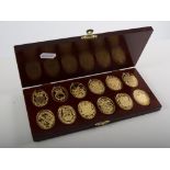 Twelve silver gilt medals, Arms of Prince and Princess of Wales, (cased).