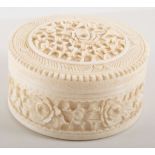 Carved ivory pin pot and cover.
