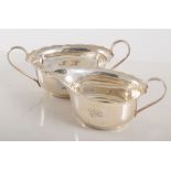 Silver milk jug and matching sugar bowl, Birmingham 1931-4, plain oval form, (2).