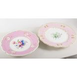 Collection of decorative hand painted plates, various floral designs, pink and green borders.