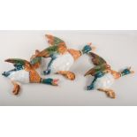 Set of four Beswick flying duck wall ornaments, No. 590, 6cms and smaller and another, (5).