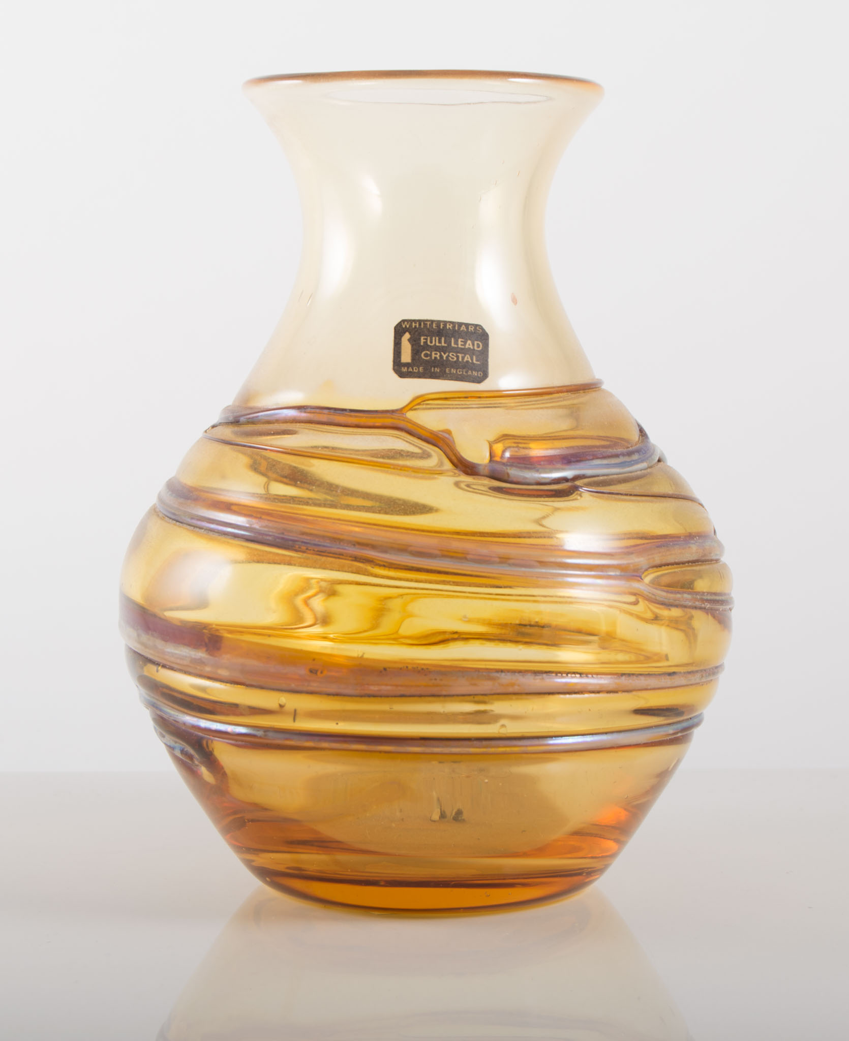 Whitefriars amber coloured trail vase, with label and number 9886, 18cms, by Peter Wheeler.