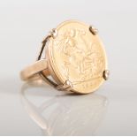 Edward VII 1909 Half Sovereign four claw set in a 9 carat yellow gold ring mount,