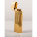 Cartier gilt metal briquette lighter, No. 17459T, 7cms, boxed and with with papers.