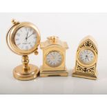 Set of eight modern miniature brass-cased timepieces.