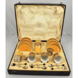English bone china coffee set, cups with pierced silver frames, with bean handled coffee spoons,