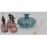 A small collection of perfume flasks and a Mdina squat vase, (7).