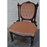 A Victorian mahogany framed nursing chair.