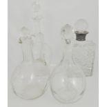 Small selection of cut glass decanters, one with silver rim and three glass jugs, (5).