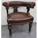 Victorian mahogany library chair, with a hoop back, upholstered in close-studded brown leather,