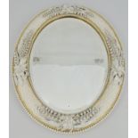 Porcelain mounted oval mirror, probably Belleek, basket weave moulded,