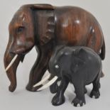 A collection of African carved elephants and other ornaments.