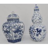 A Chinese blue and white gourd shaped vase, the top damaged,