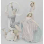 Lladro figure, of a dancer with a swag, 24cms and three Nao models of dancers, (4).