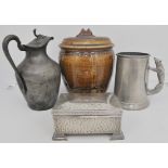 A quantity of pewter and britannia metal wares, including tankards, measures, candlesticks,