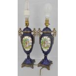 Pair of Continental pottery lamps, with gilt metal mounts, urn shape bodies,