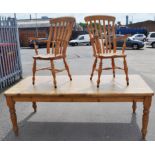 A modern pine kitchen table and a set of eight slat back chairs, (9).