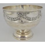 Silver pedestal bowl, circular form, applied floral wreath border with ribbon ties, moulded girdle,