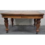 Victorian oak wind-out dining table, one extra leaf.