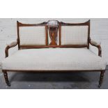 A Victorian inlaid mahogany salon suite, comprising settee, two armchairs and two single chairs,