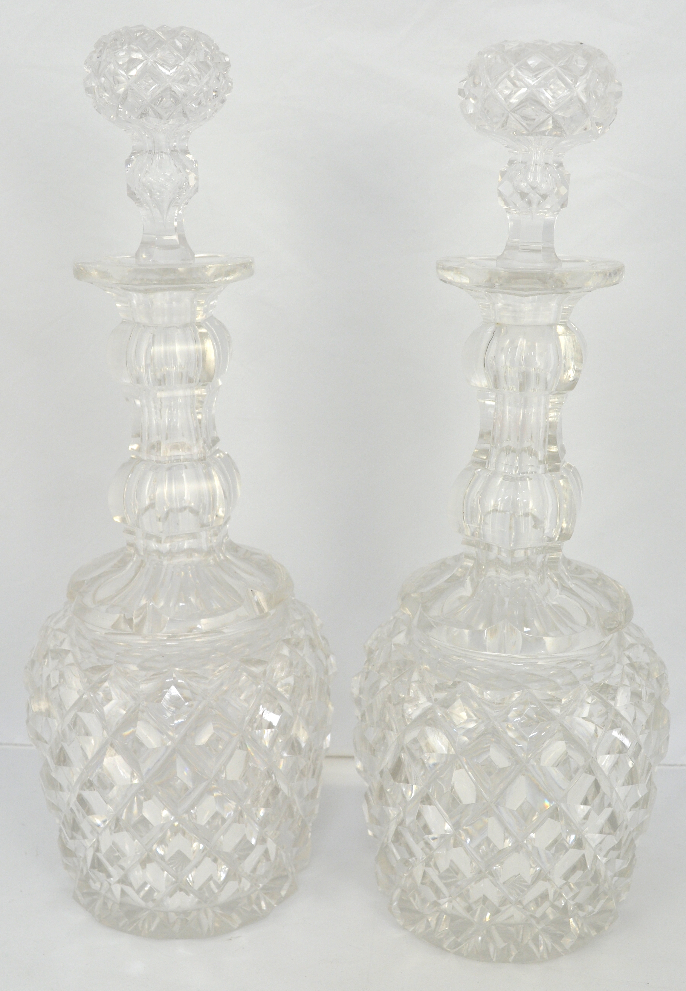 Pair of Waterford style cut glass decanters, with stoppers, height 24cm.