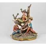 Large Capodimonte porcelain group, Three Boys around the Camp Fire, signed Volta, height 34cm.