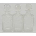 Set of three cut glass decanters, with stoppers, height 22cm.