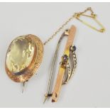 A 9 carat yellow gold brooch, set with an oval mixed cut citrine 20mmx15mm,