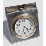 Silver faced travelling clock, London 1924, white enamel dial,