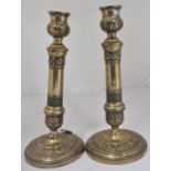 A pair of 18th Century brass candlesticks, height 27cms.