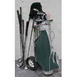 A full set of Mitsushiba “stealthy” golf clubs in a bag with trolley,