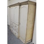 A Victorian painted triple wardrobe, panelled doors enclosing slides, breakfast,